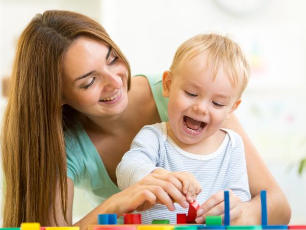 Mother and son playing with puzzle