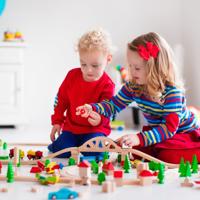 Children playing with wooden train