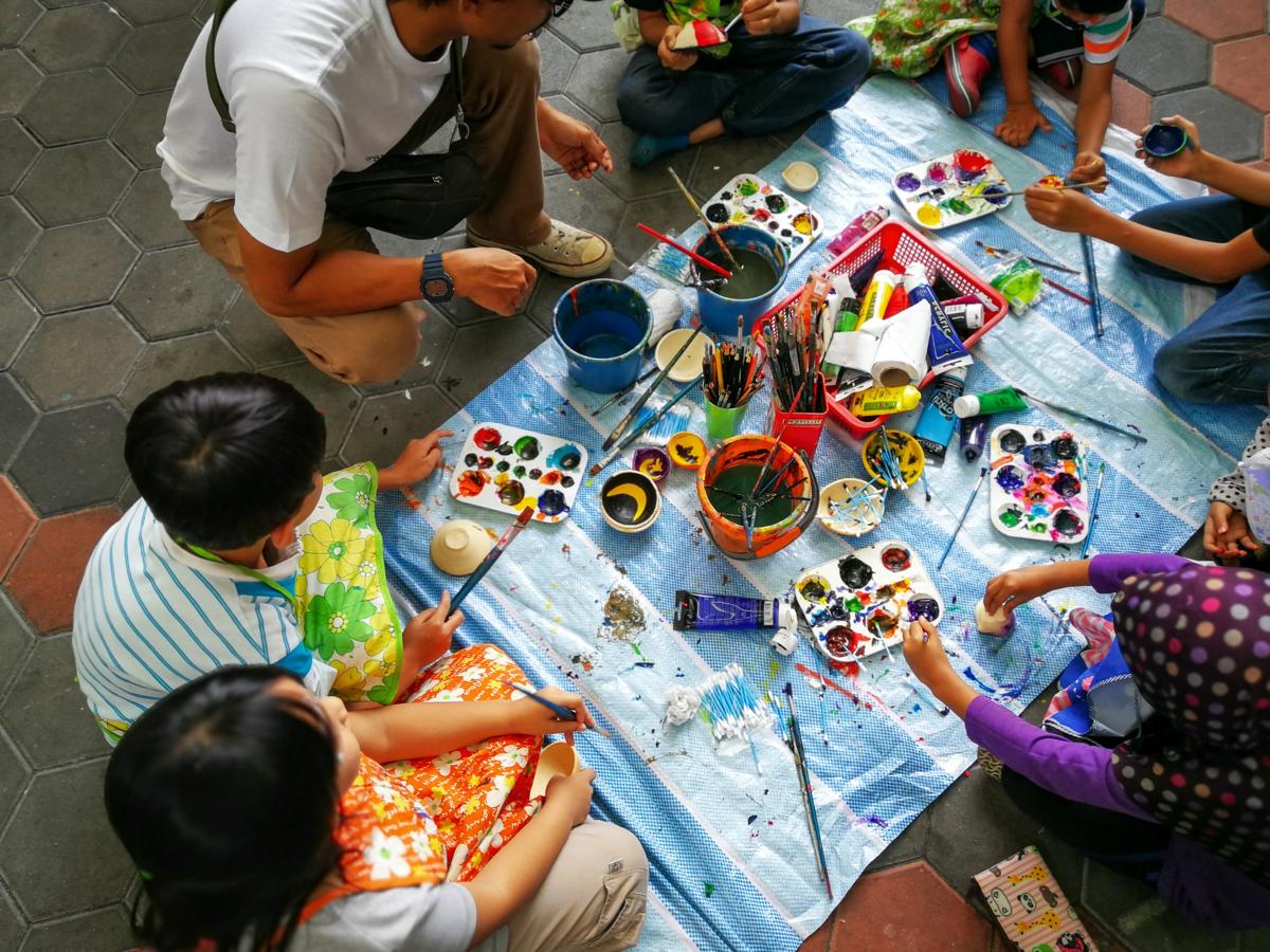 Children painting outdoors