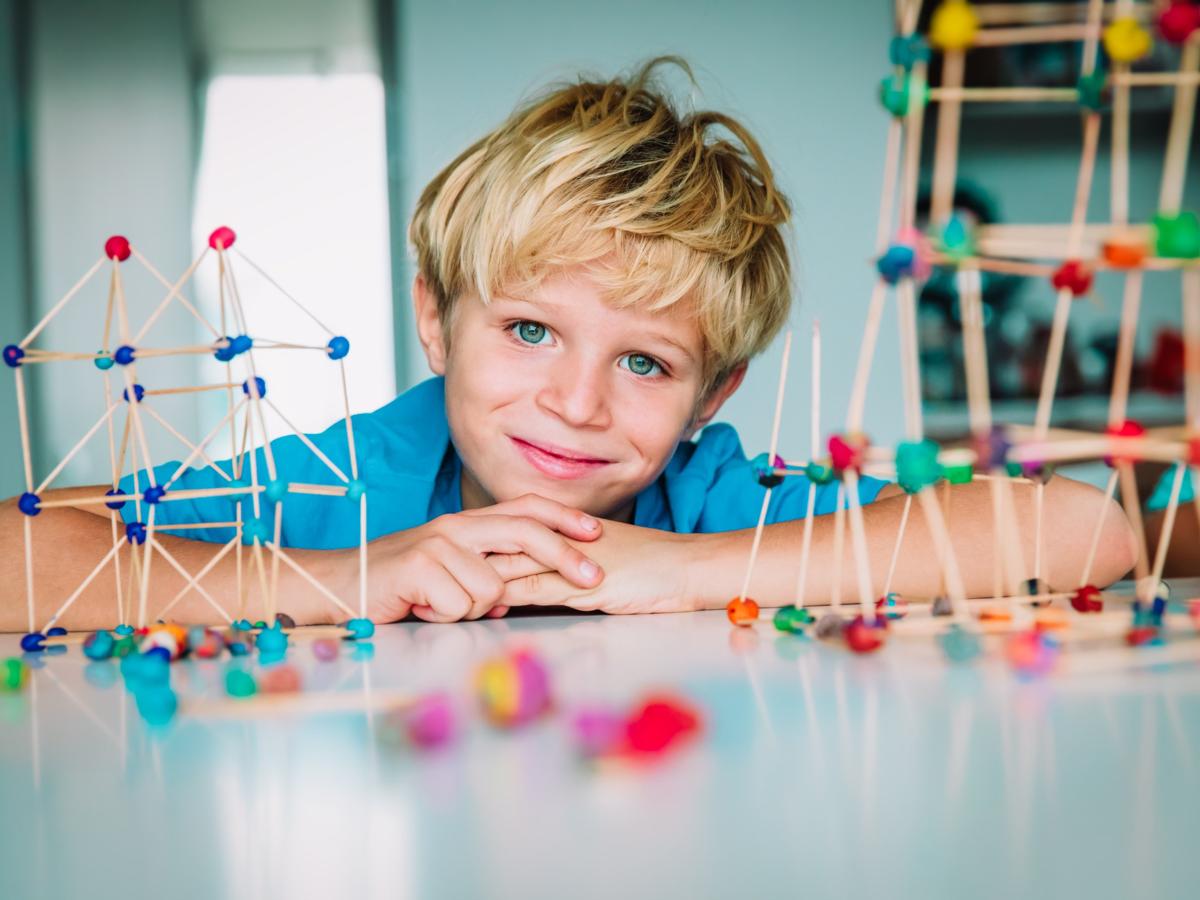 Child building geometric shapes