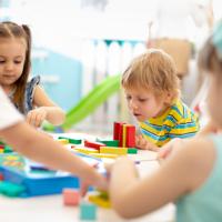 Kindergarten children playing with blocks