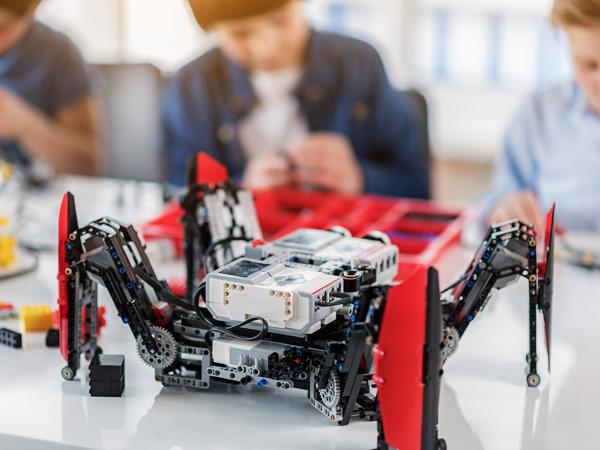 Children building robot spider